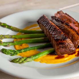 Duck Magret with Carrot Purée and green asparagus | Le Gargantua Cooking Vacations