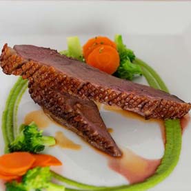 Duck Magret à L'Orange with Spring Pea Pur&eacutee 