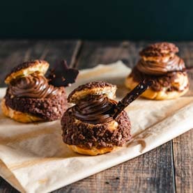 Chocolate Choux pastries with chocolate craquelin. 